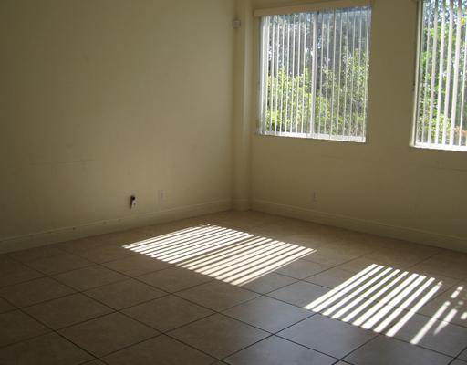 4262 Coventry Pointe Way Lake Worth, FL 33461 - Photo 4 of 12 a view of wooden floor in an empty room