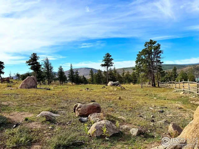 a view of a lake with a yard