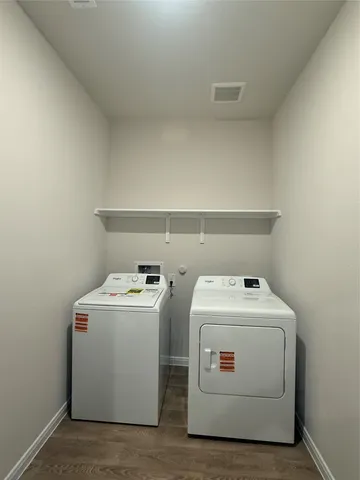 a utility room with dryer and washer