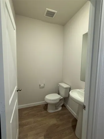 a bathroom with a toilet and a sink