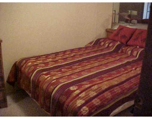 3938 Surfside, Unit 1322 Corpus Christi, TX 78402 - Photo 4 of 5 a close up of a bed