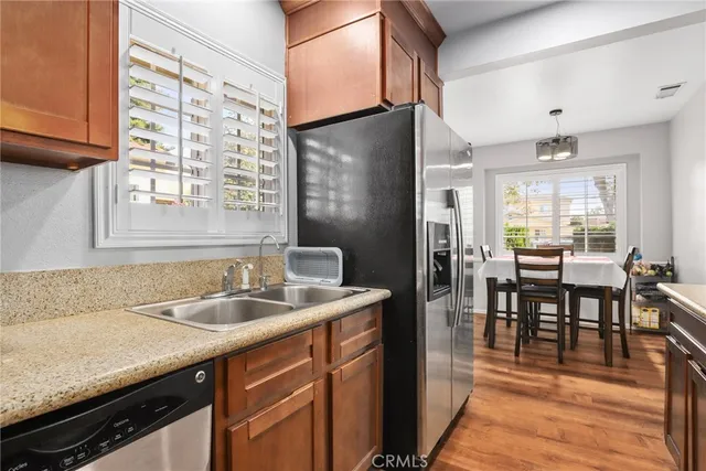 a kitchen with sink cabinets and dining table
