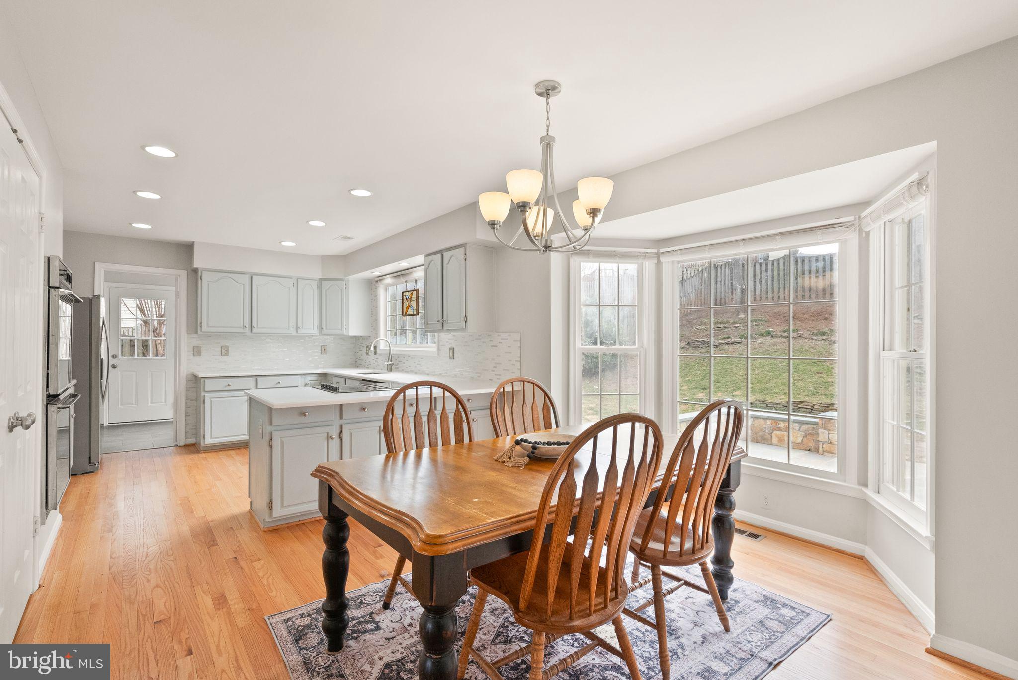 6833 Compton Heights Circle Clifton, VA 20124 - Photo 20 of 81 a view of a dining room with furniture window and wooden floor