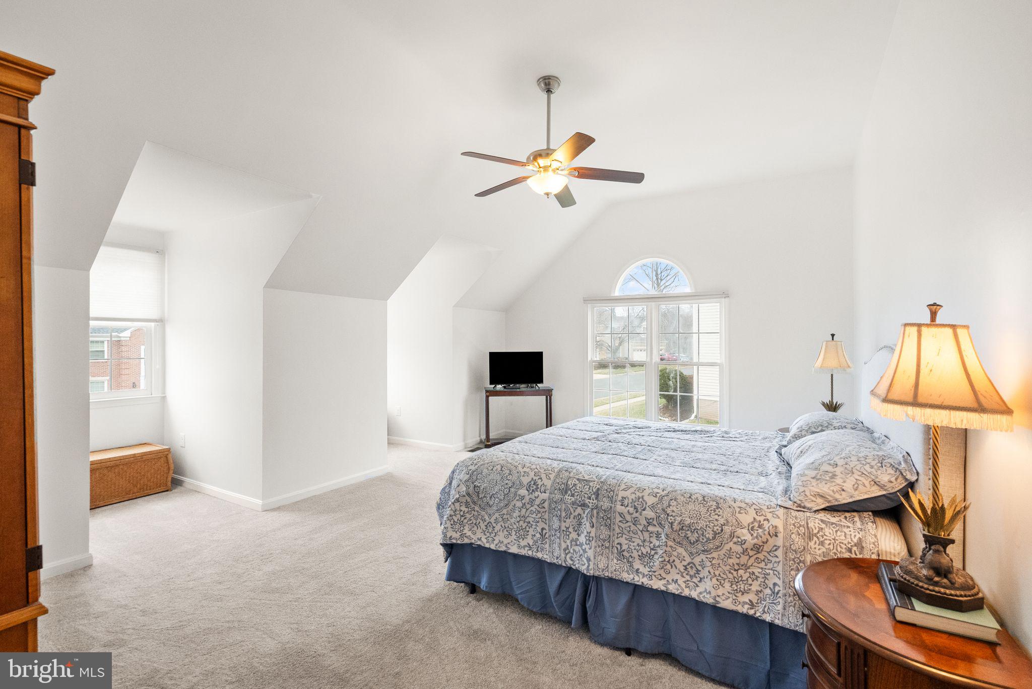 6833 Compton Heights Circle Clifton, VA 20124 - Photo 36 of 81 a bedroom with a bed chandelier and a window