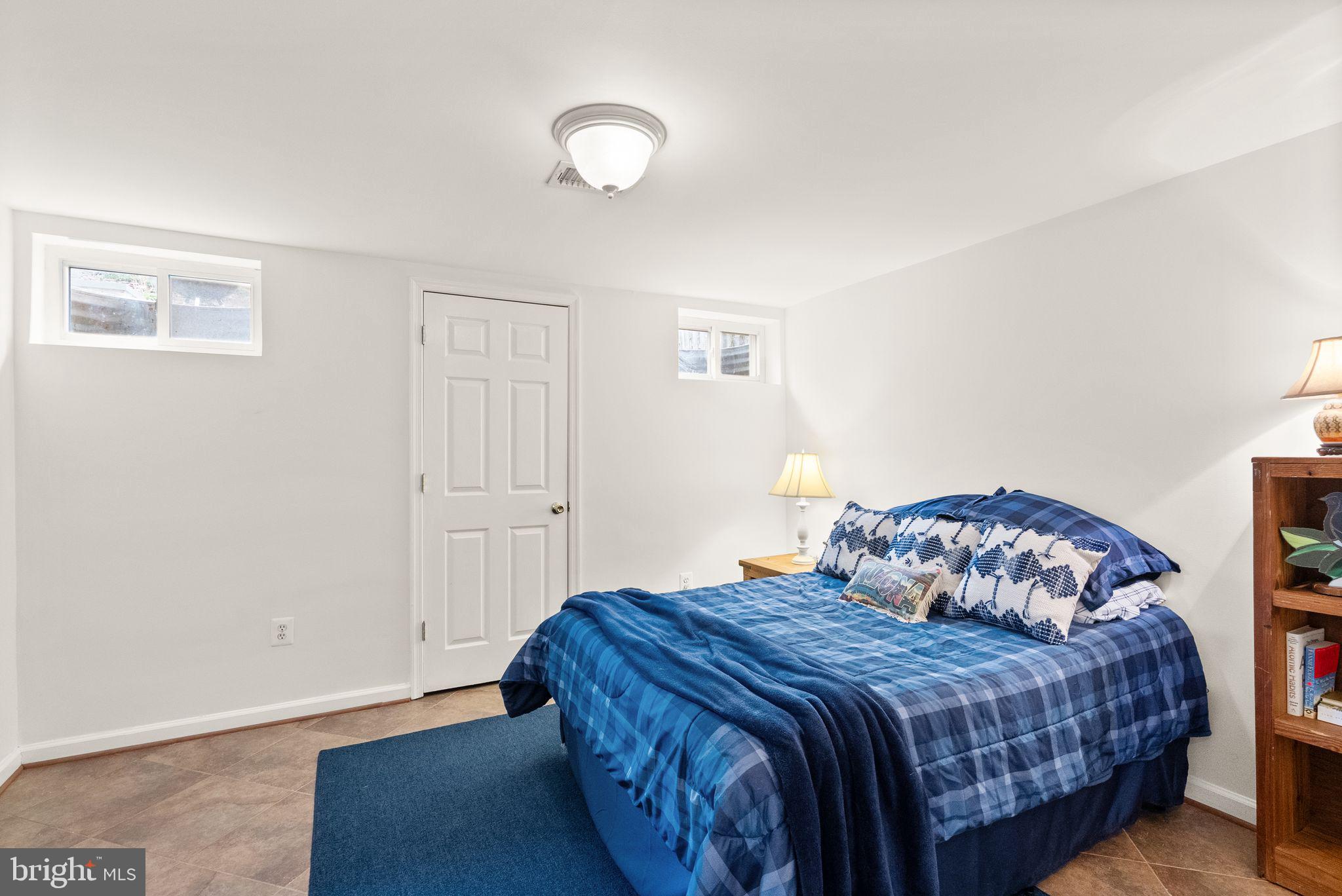 6833 Compton Heights Circle Clifton, VA 20124 - Photo 62 of 81 a bedroom with a bed and a window
