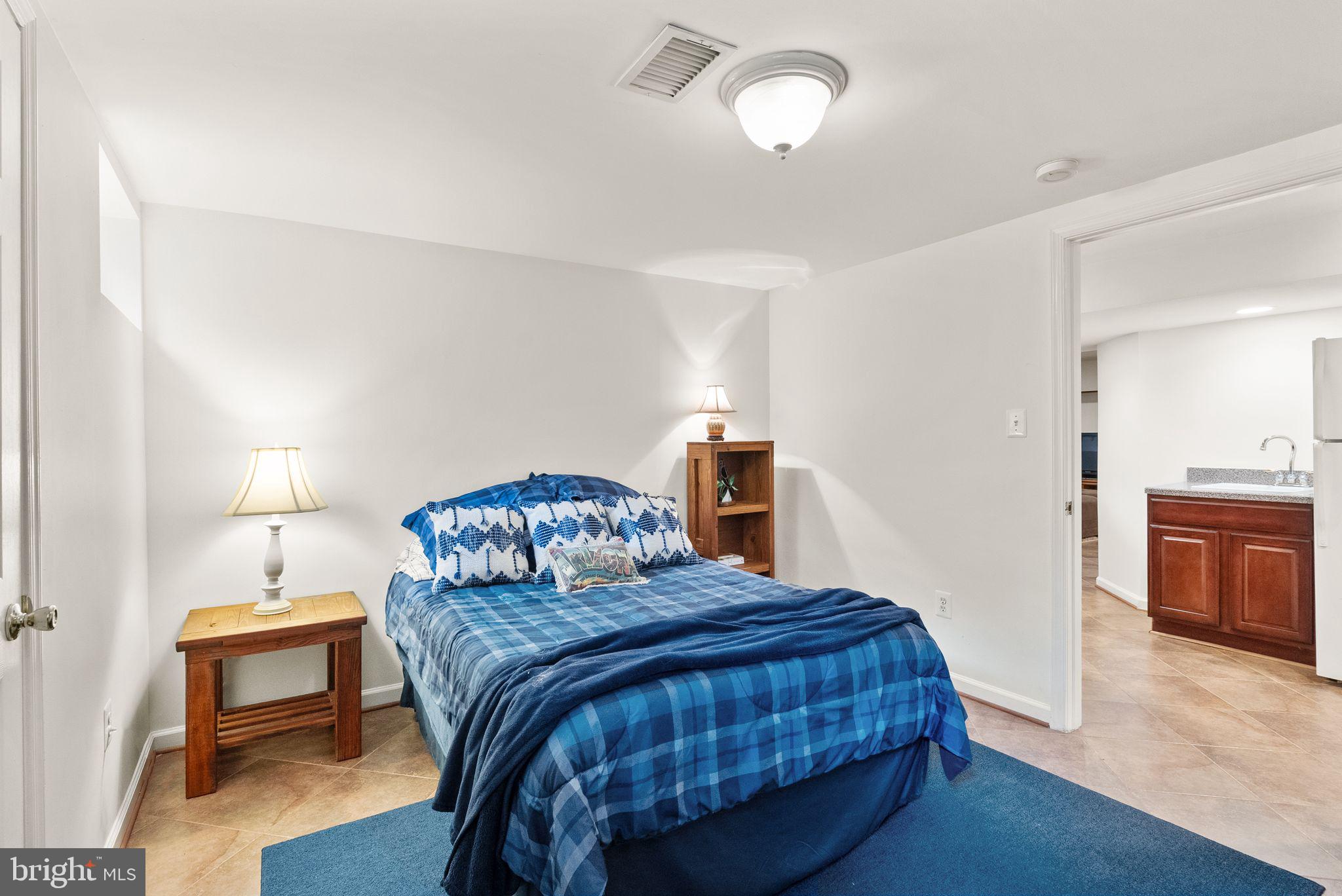 6833 Compton Heights Circle Clifton, VA 20124 - Photo 63 of 81 a bedroom with a bed and a view of kitchen
