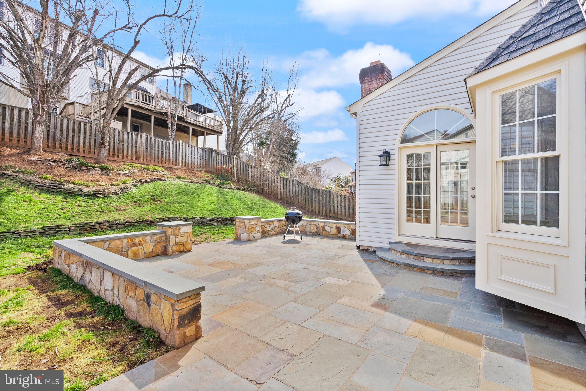 6833 Compton Heights Circle Clifton, VA 20124 - Photo 65 of 81 a view of a backyard with a deck and a garden