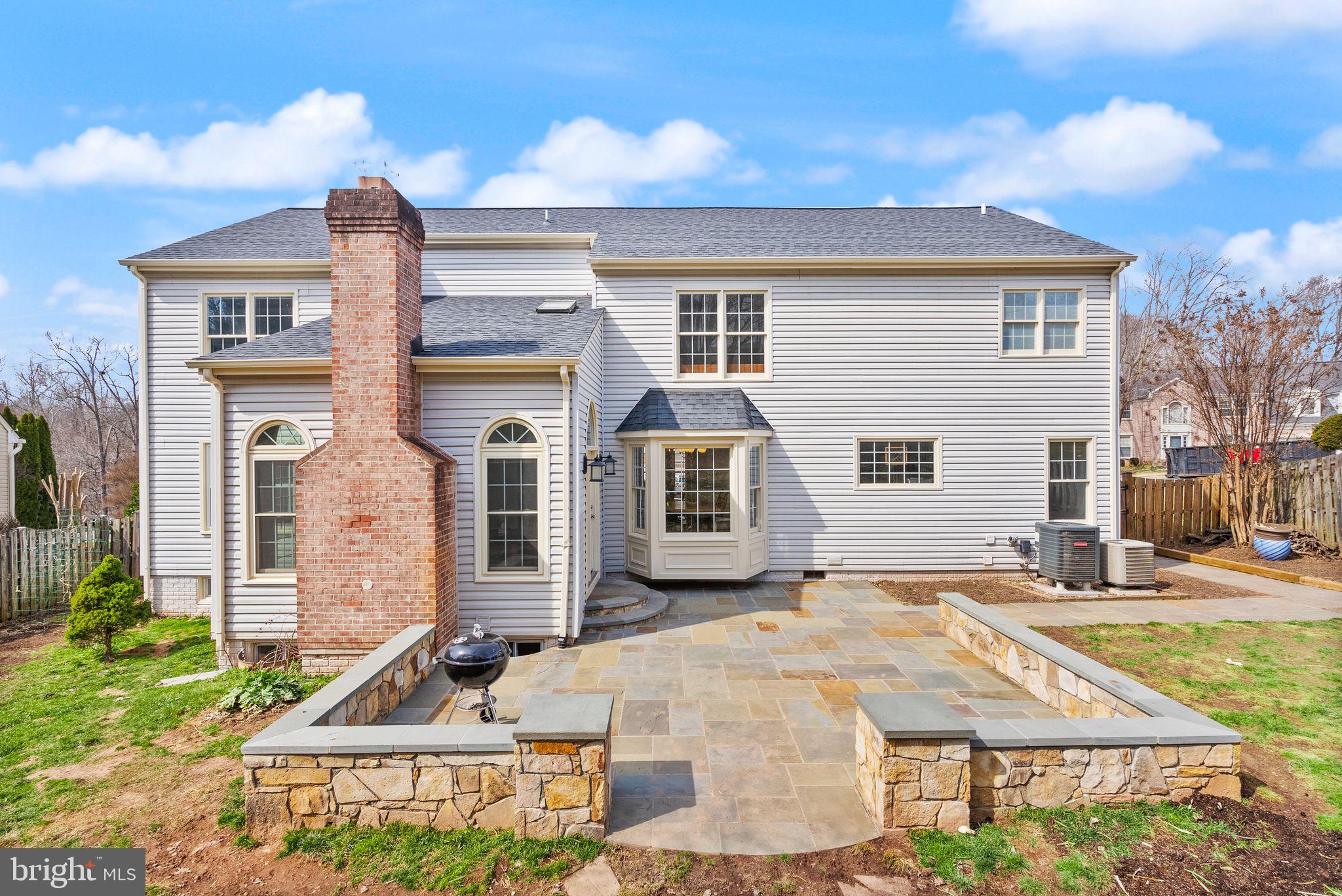 6833 Compton Heights Circle Clifton, VA 20124 - Photo 70 of 81 a front view of a house with a yard
