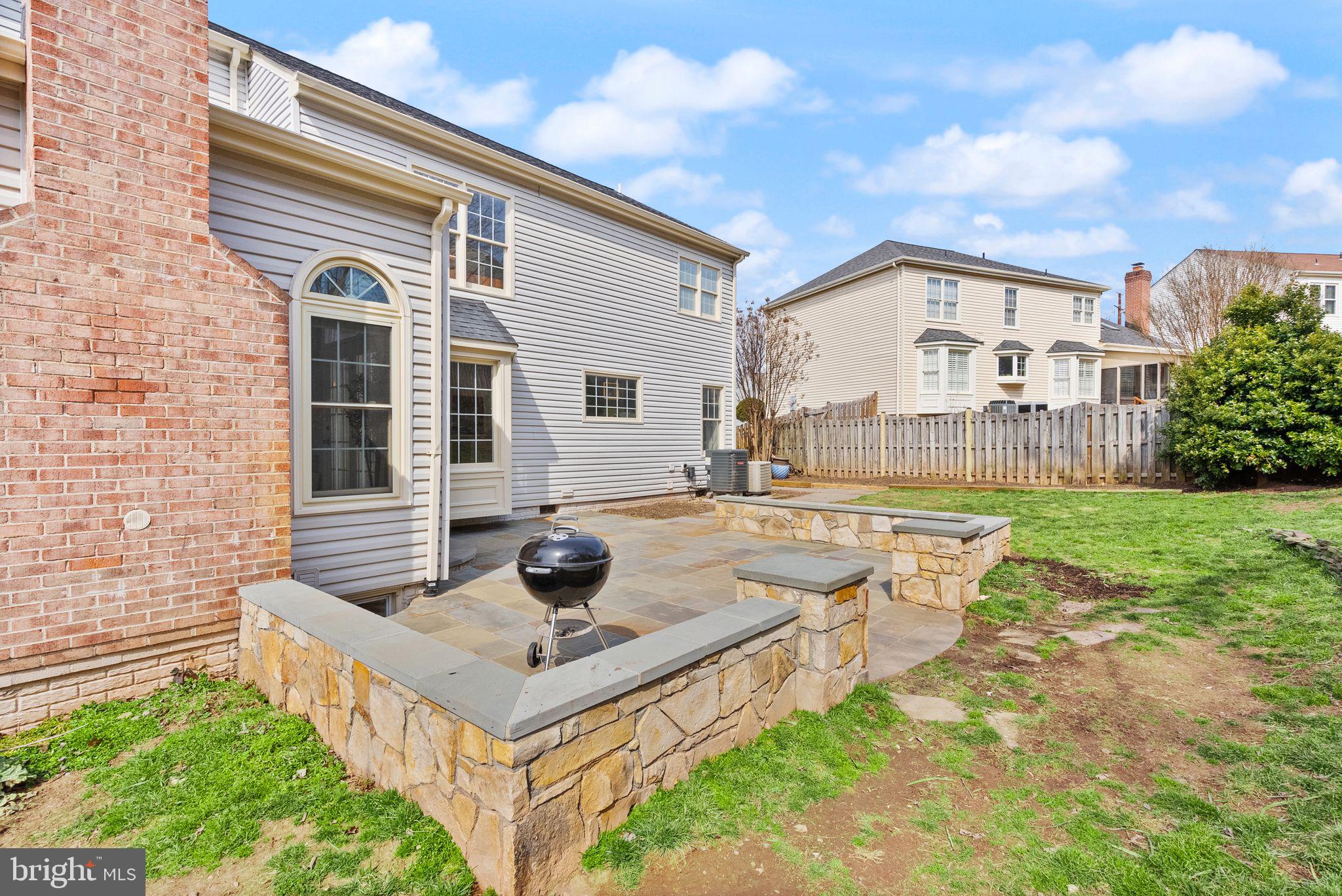 6833 Compton Heights Circle Clifton, VA 20124 - Photo 71 of 81 a view of house and yard with swimming pool and sitting area