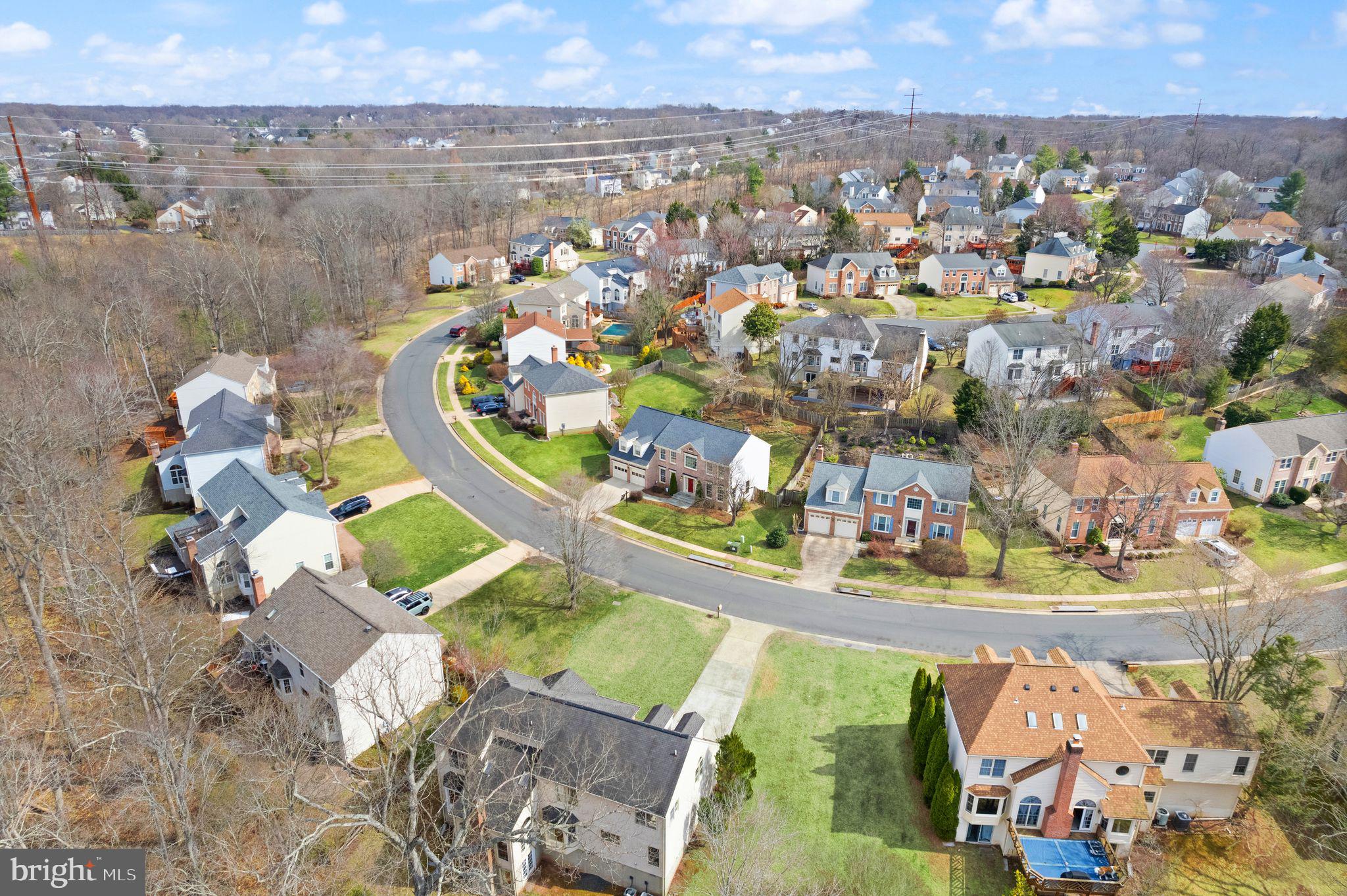 6833 Compton Heights Circle Clifton, VA 20124 - Photo 78 of 81 an aerial view of a house with a swimming pool