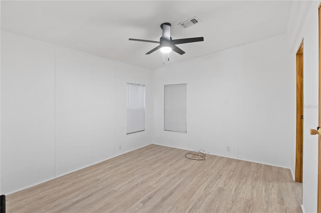 15550 Burnt Store Road, Unit 229 Punta Gorda, FL 33955 - Photo 15 of 40 wooden floor in an empty room