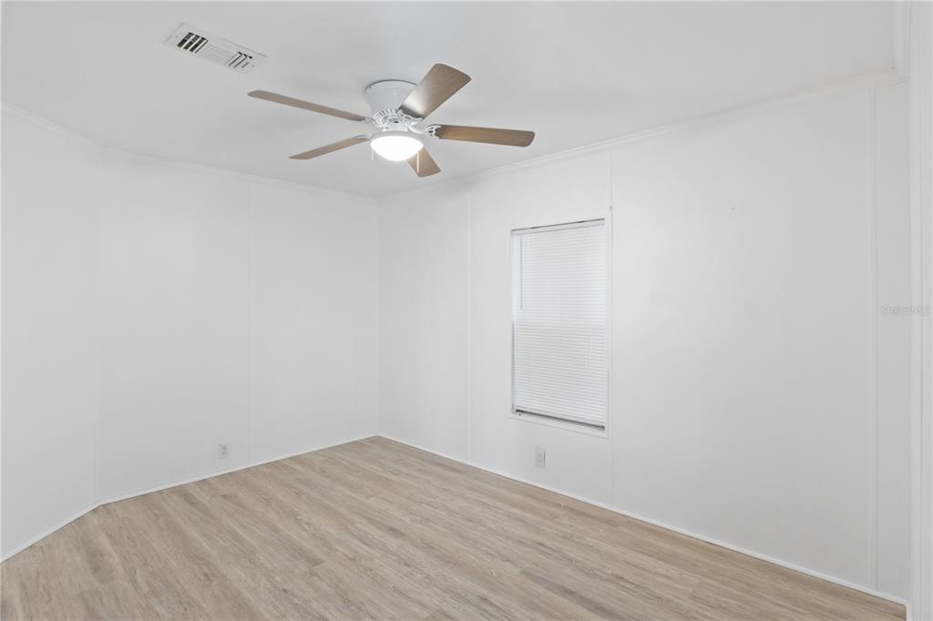 15550 Burnt Store Road, Unit 229 Punta Gorda, FL 33955 - Photo 18 of 40 a view of a room with wooden floor and closet