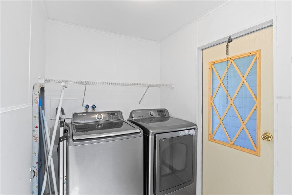 15550 Burnt Store Road, Unit 229 Punta Gorda, FL 33955 - Photo 21 of 40 a utility room with dryer and washer