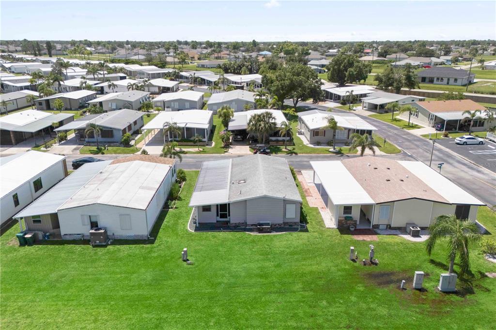15550 Burnt Store Road, Unit 229 Punta Gorda, FL 33955 - Photo 28 of 40 a view of multiple houses with yard