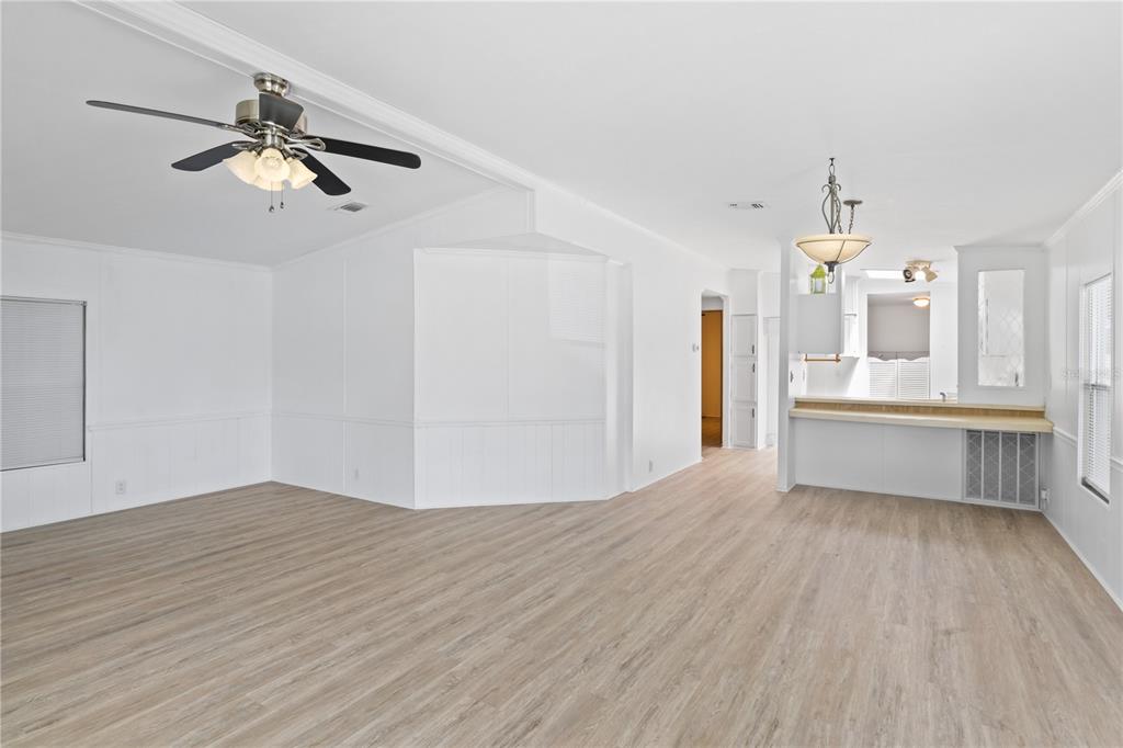 15550 Burnt Store Road, Unit 229 Punta Gorda, FL 33955 - Photo 5 of 40 a view of a big room with wooden floor and windows