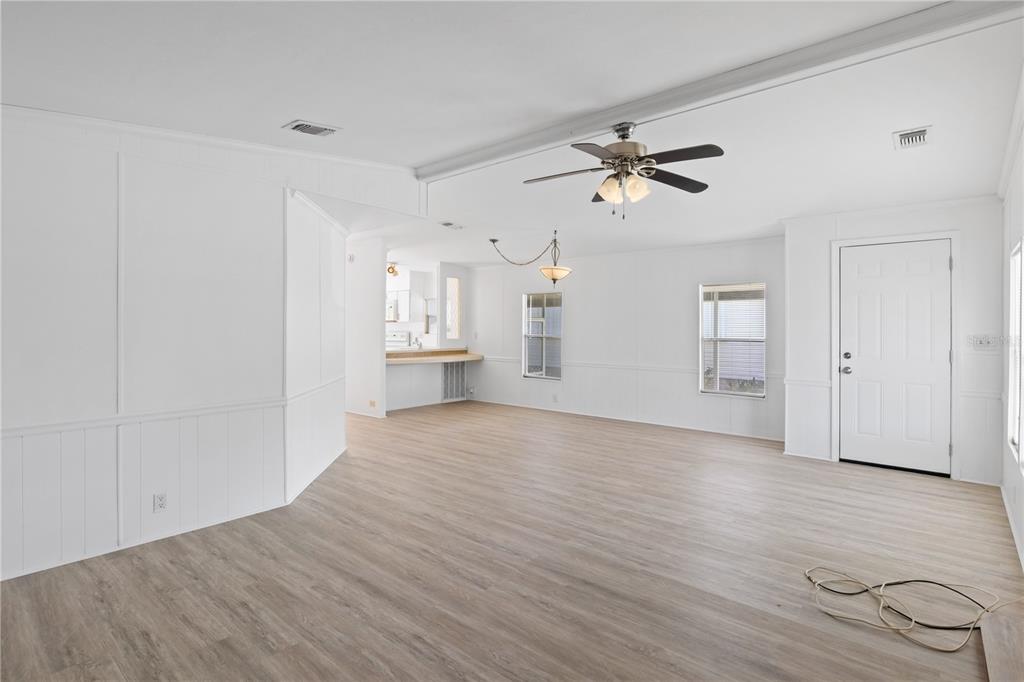 15550 Burnt Store Road, Unit 229 Punta Gorda, FL 33955 - Photo 8 of 40 wooden floor in an empty room with a window