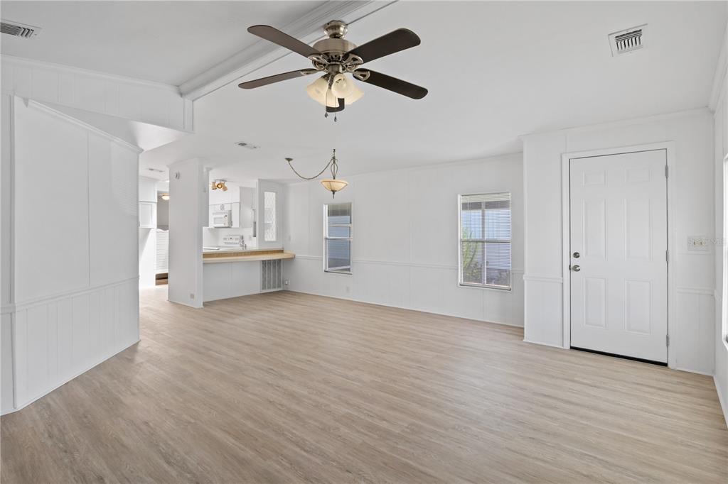 15550 Burnt Store Road, Unit 229 Punta Gorda, FL 33955 - Photo 10 of 40 wooden floor in an empty room with a window