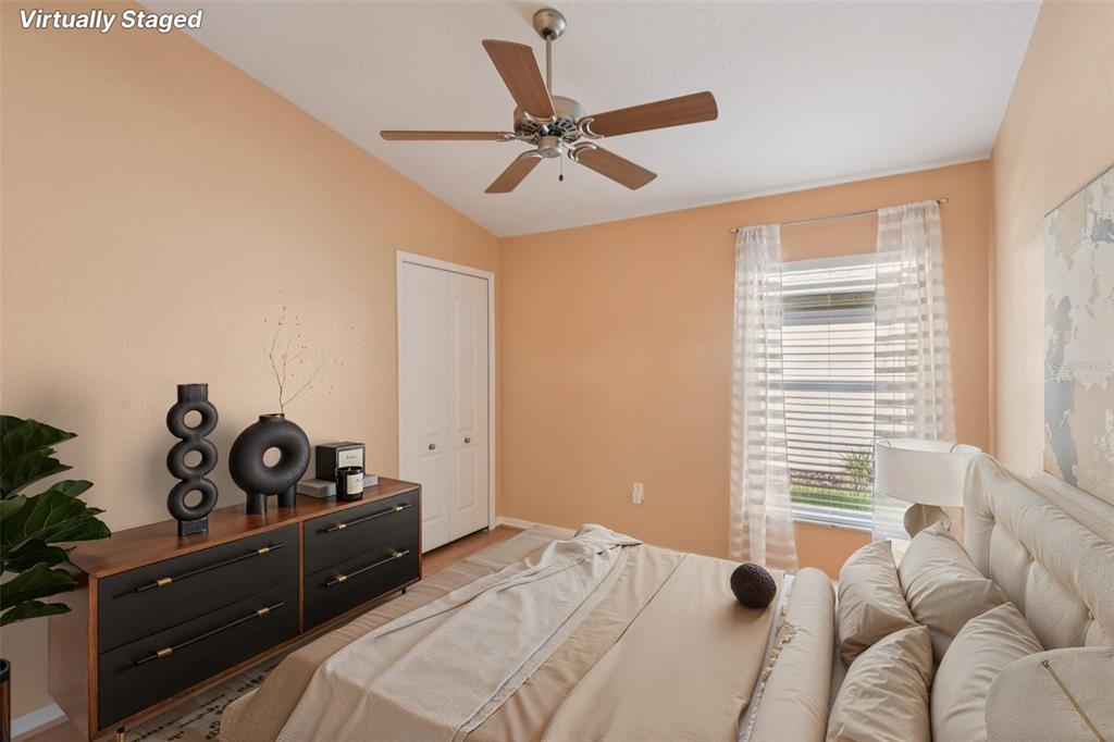 11705 Spindrift Loop Hudson, FL 34667 - Photo 14 of 34 a bedroom with a bed and a window