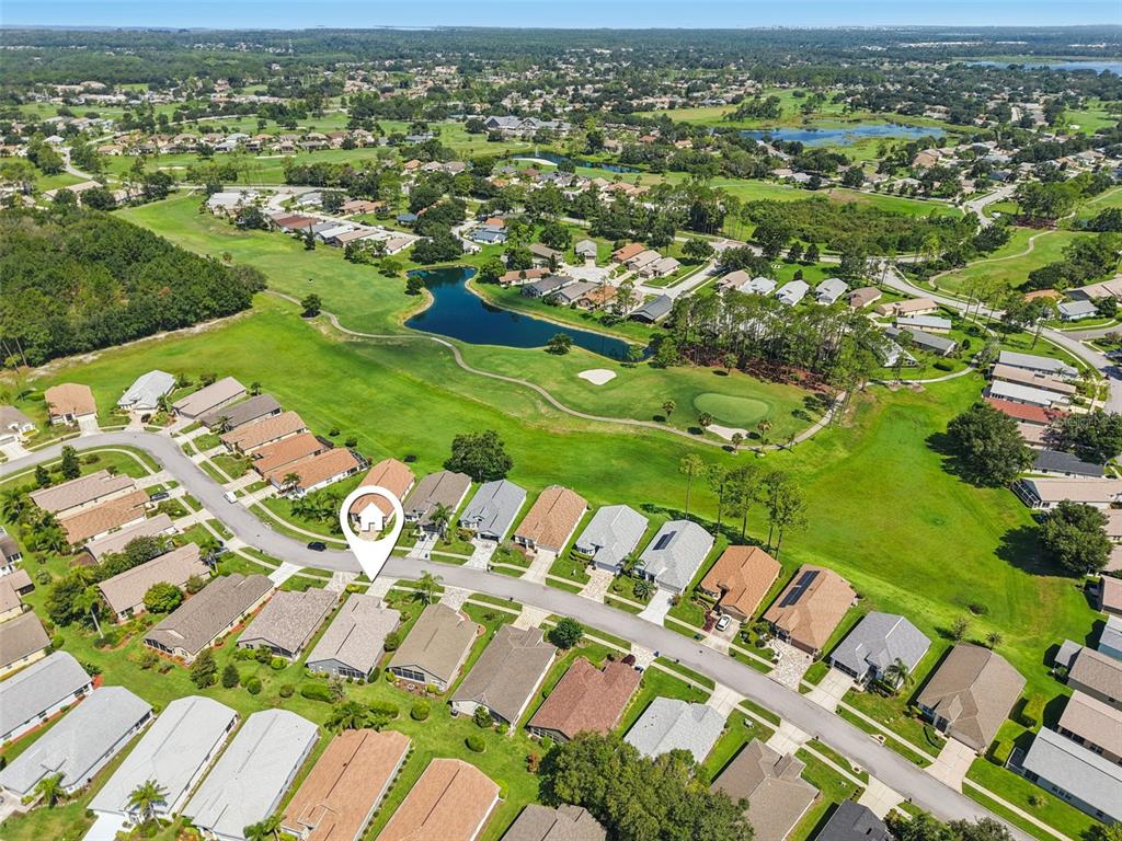11705 Spindrift Loop Hudson, FL 34667 - Photo 25 of 34 an aerial view of residential houses with outdoor space