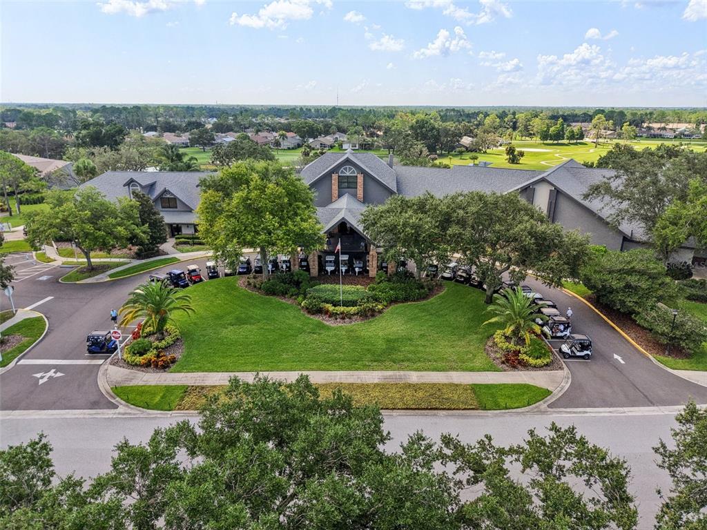 11705 Spindrift Loop Hudson, FL 34667 - Photo 26 of 34 an aerial view of a house with a garden and lake view