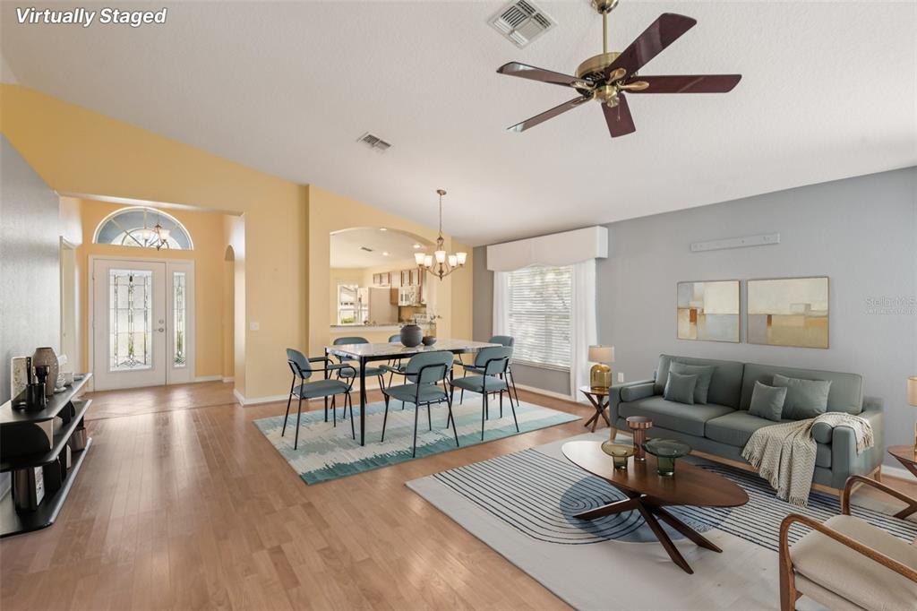 11705 Spindrift Loop Hudson, FL 34667 - Photo 9 of 34 a living room with furniture and a wooden floor