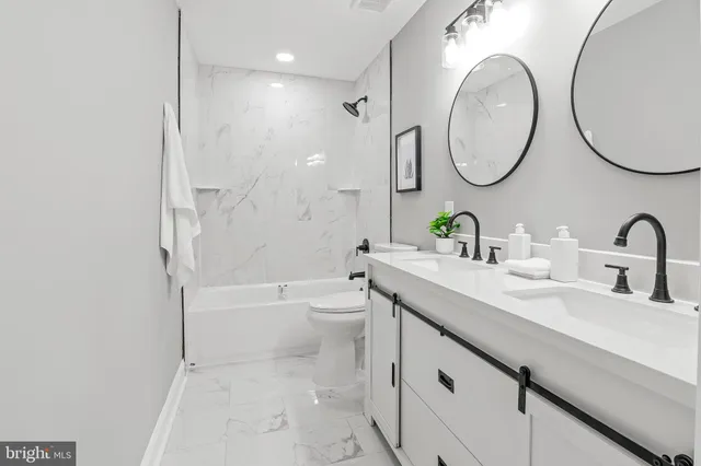 a view of a small space with wooden floor and a window
