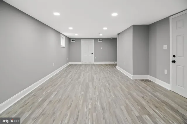 a view of room with wooden floor