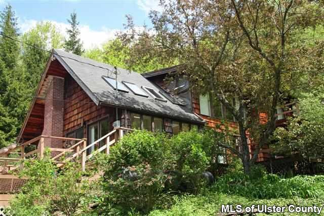 337 John Hewitt Road Roxbury, NY 12474 - Photo 1 of 17 a backyard of a house with lots of green space