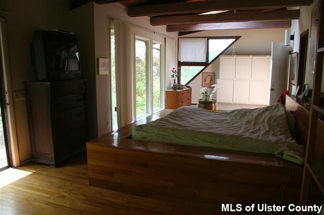 337 John Hewitt Road Roxbury, NY 12474 - Photo 7 of 17 a bedroom with a bed and a large window