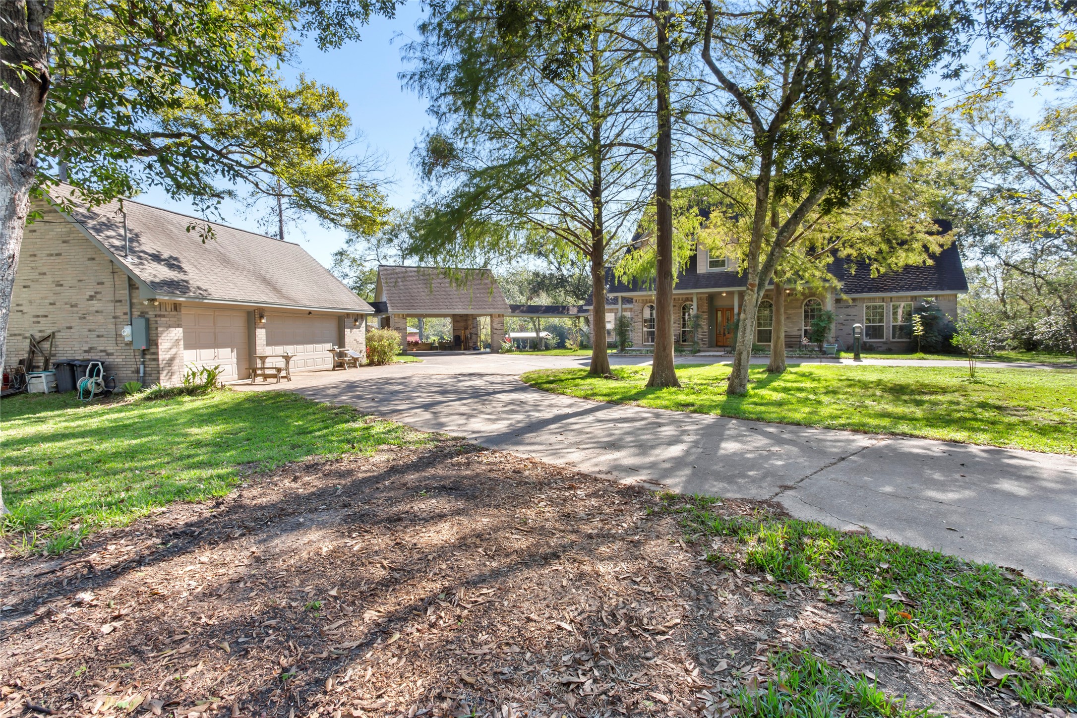 860 FM 517 Road East Dickinson, TX 77539 - Photo 10 of 50 a view of a house with a yard and tree s