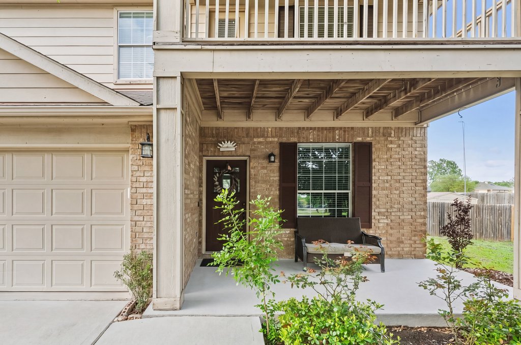 140 Wolfberry Path Buda, TX 78610 - Photo 2 of 35 a front view of a house with a yard