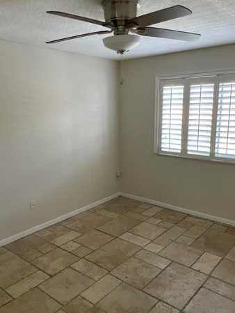 a view of an empty room and a window
