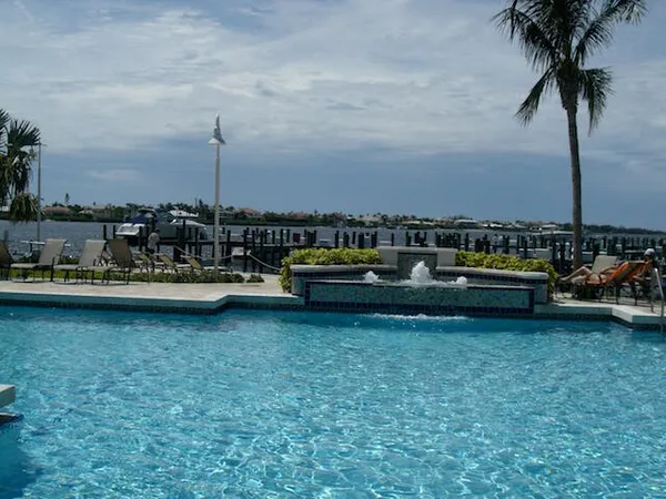 a view of a lake with boats and trees