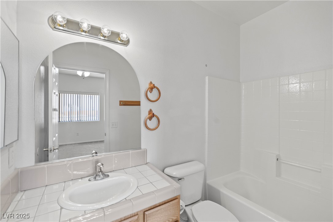 1430 Star Road Pahrump, NV 89048 - Photo 30 of 32 Bathroom featuring vanity and bathtub / shower combination
