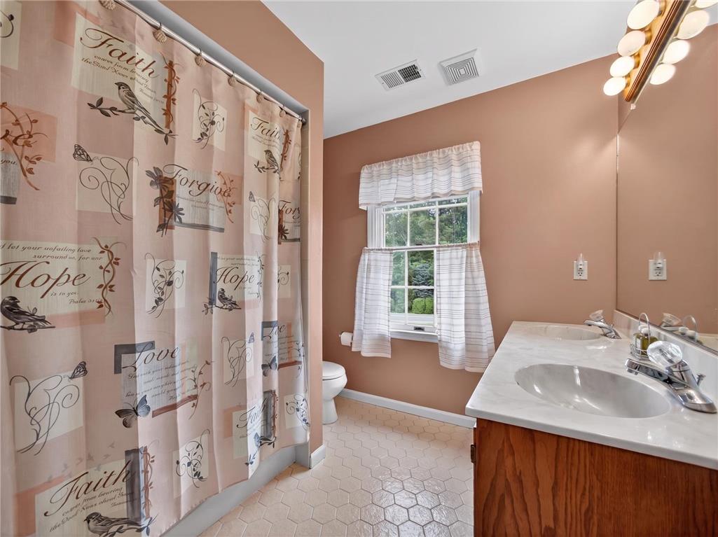 853 Lahr Road Nazareth, PA 18064 - Photo 19 of 29 A well-appointed bathroom features a practical vanity with dual sinks, ready for daily routines.