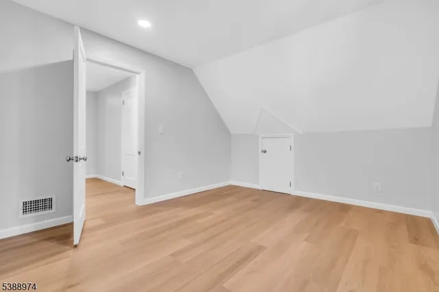 an empty room with wooden floor