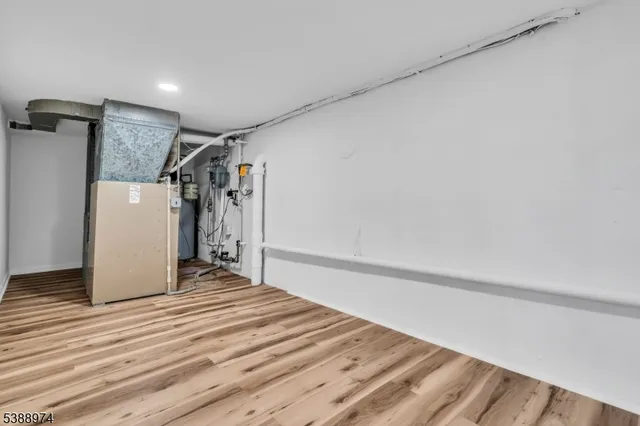 a view of a room with wooden floor and stairs