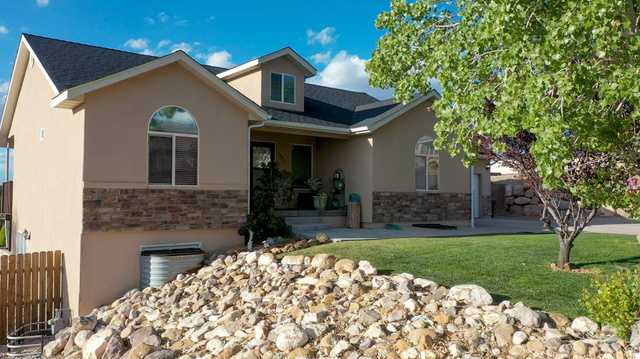 1797 Sunset Road Enoch, UT 84721 - Photo 75 of 80 Stucco exterior with stone accent siding and dark shingle roofing