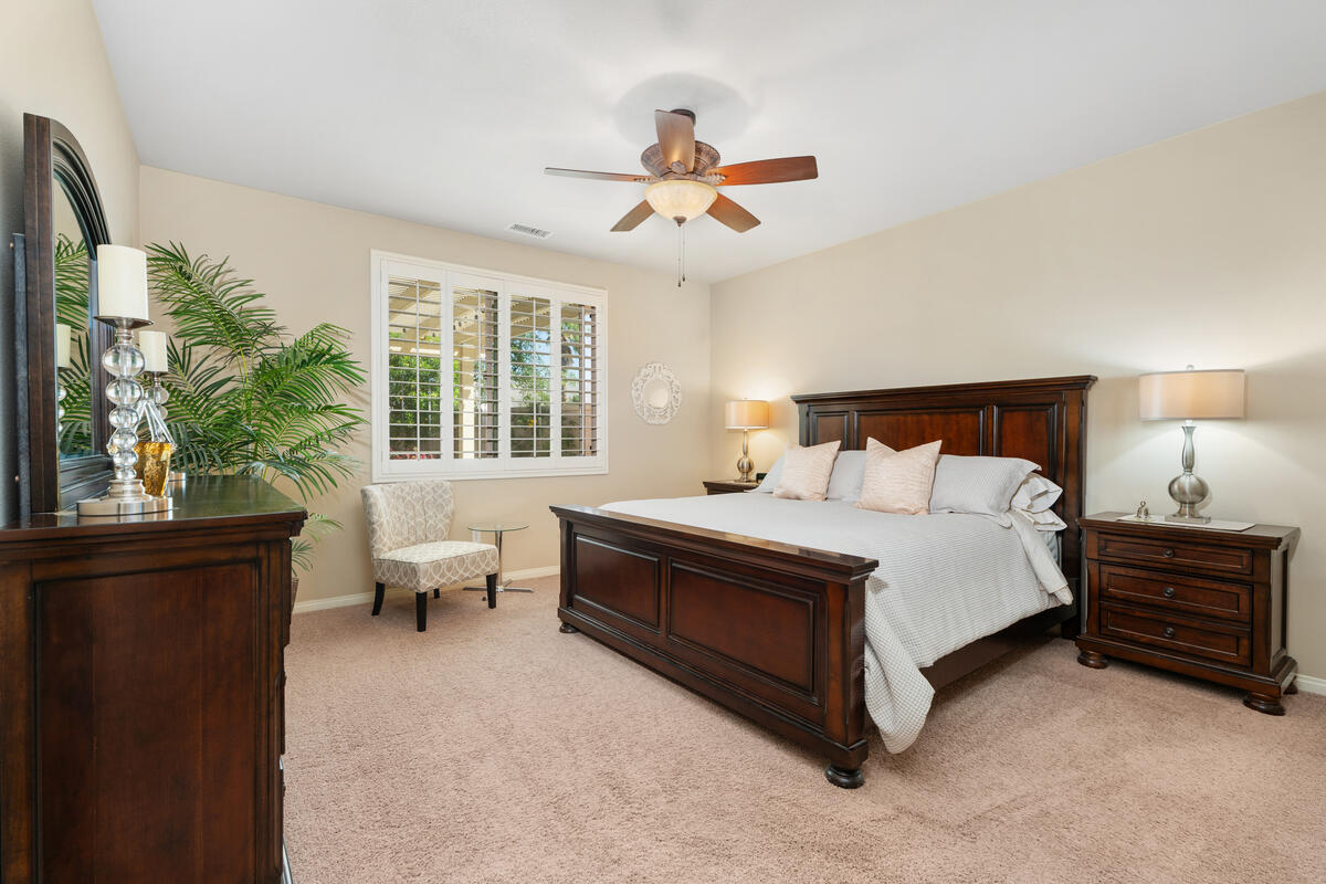 81220 Corte Tolon Indio, CA 92203 - Photo 12 of 42 a bedroom with a large bed and windows