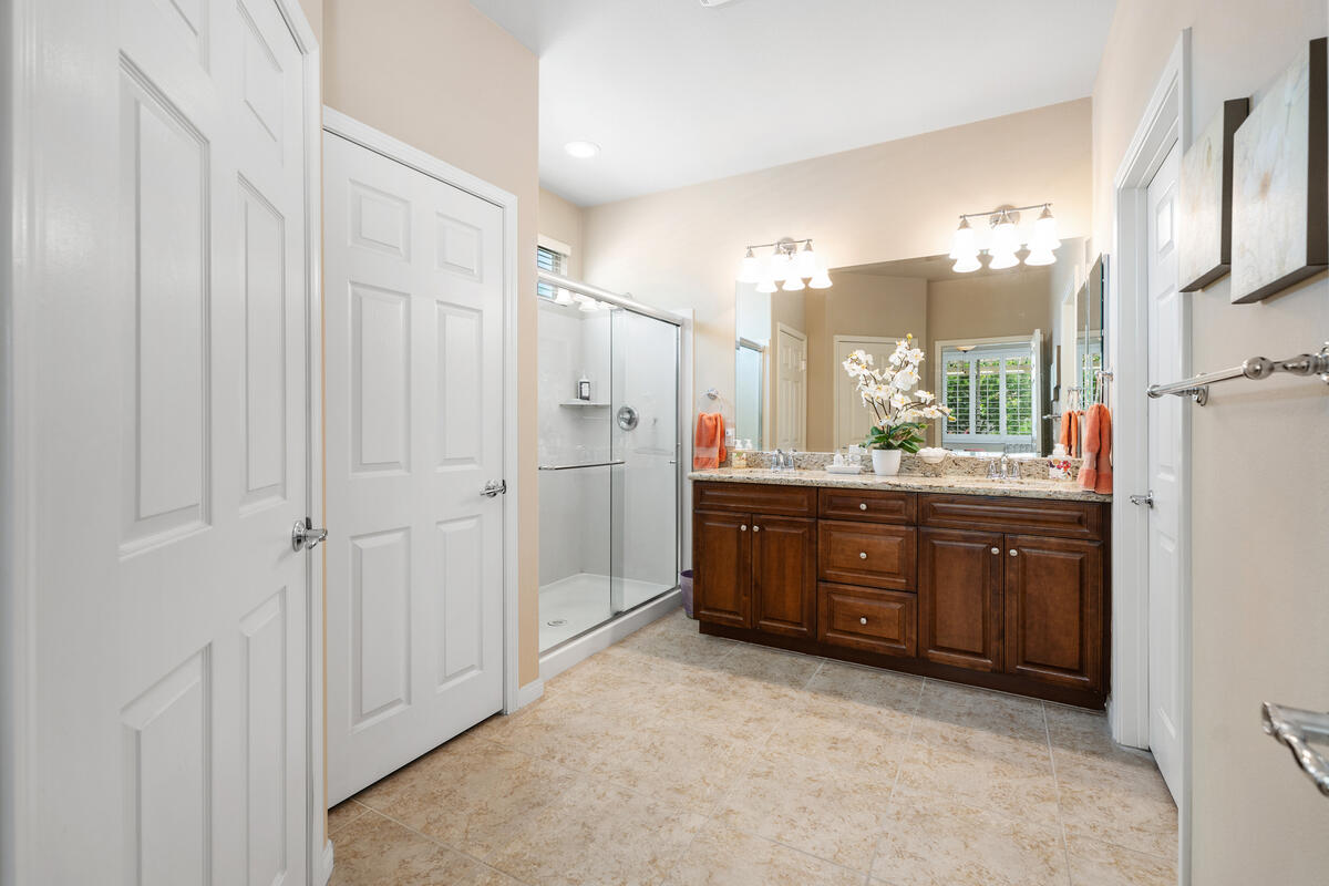 81220 Corte Tolon Indio, CA 92203 - Photo 15 of 42 a bathroom with a granite countertop sink mirror and a