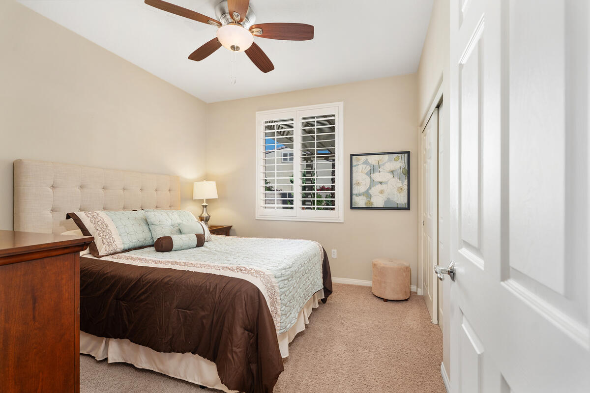 81220 Corte Tolon Indio, CA 92203 - Photo 16 of 42 a bedroom with a bed and a window