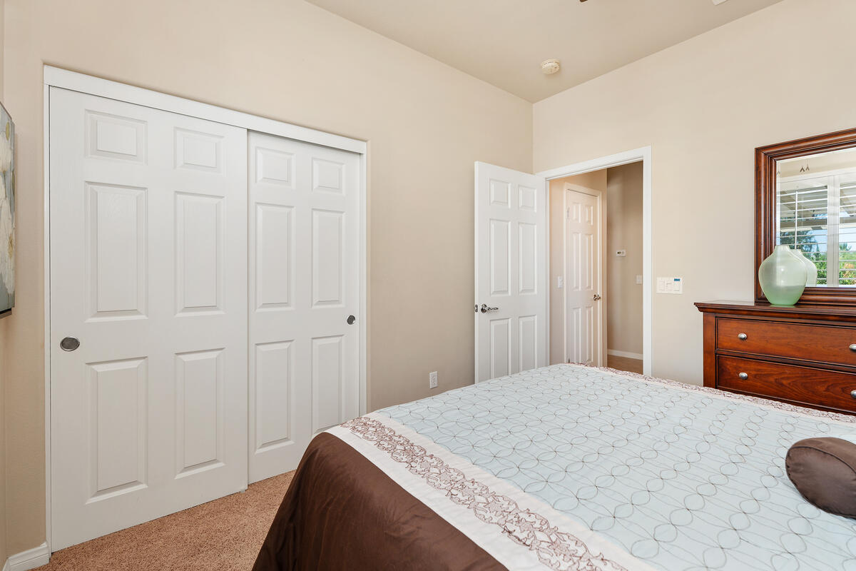 81220 Corte Tolon Indio, CA 92203 - Photo 17 of 42 a bedroom with a bed and a dresser