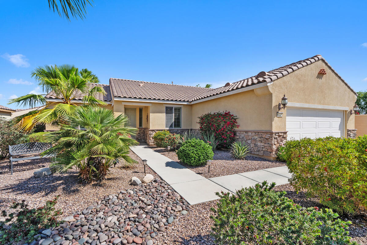 81220 Corte Tolon Indio, CA 92203 - Photo 2 of 42 a front view of a house with a yard