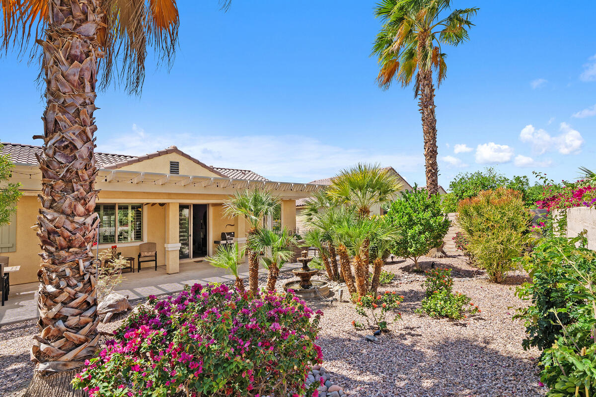 81220 Corte Tolon Indio, CA 92203 - Photo 24 of 42 a front view of a house with a garden