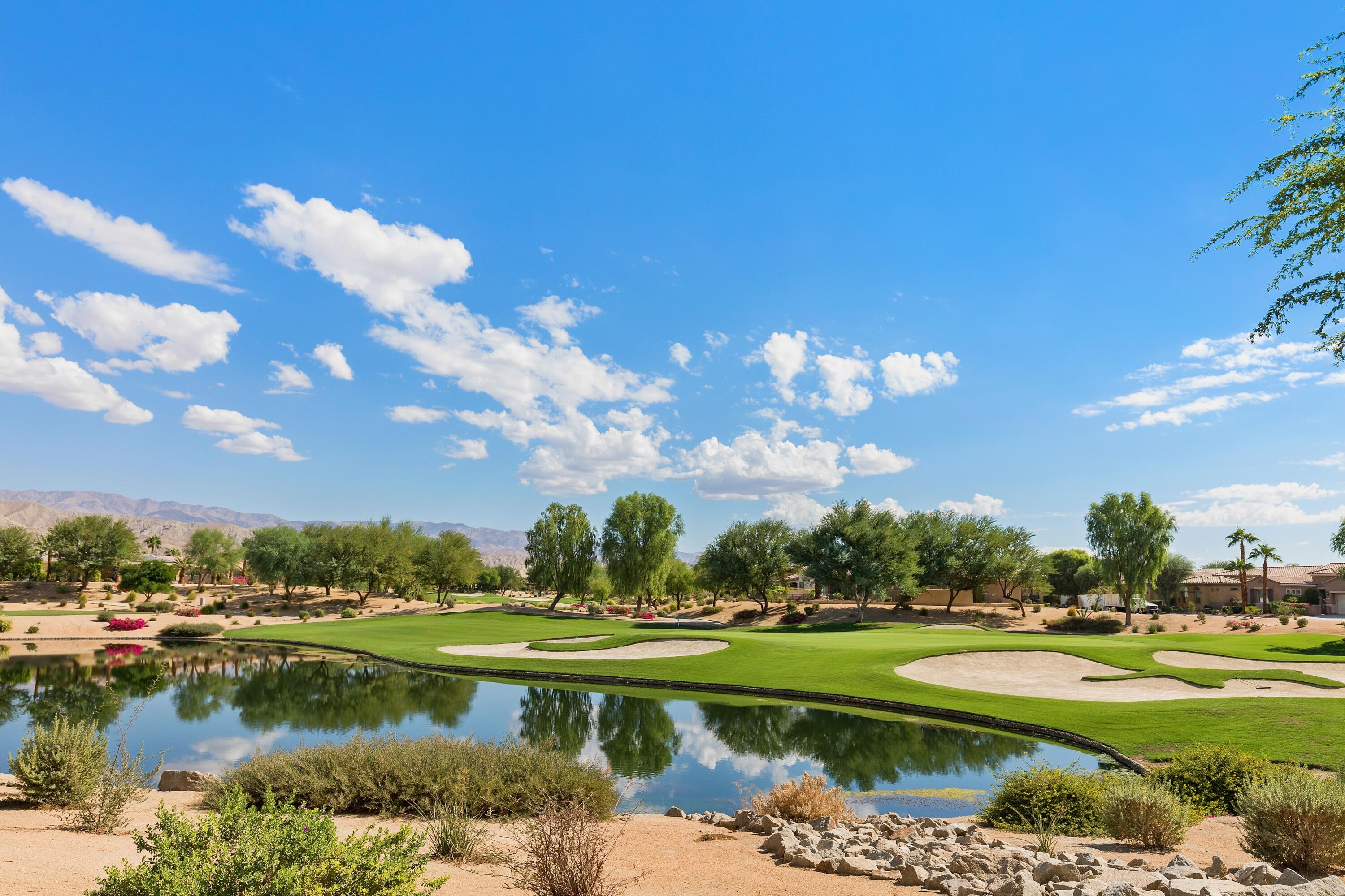81220 Corte Tolon Indio, CA 92203 - Photo 29 of 42 a view of residential house with outdoor space and lake