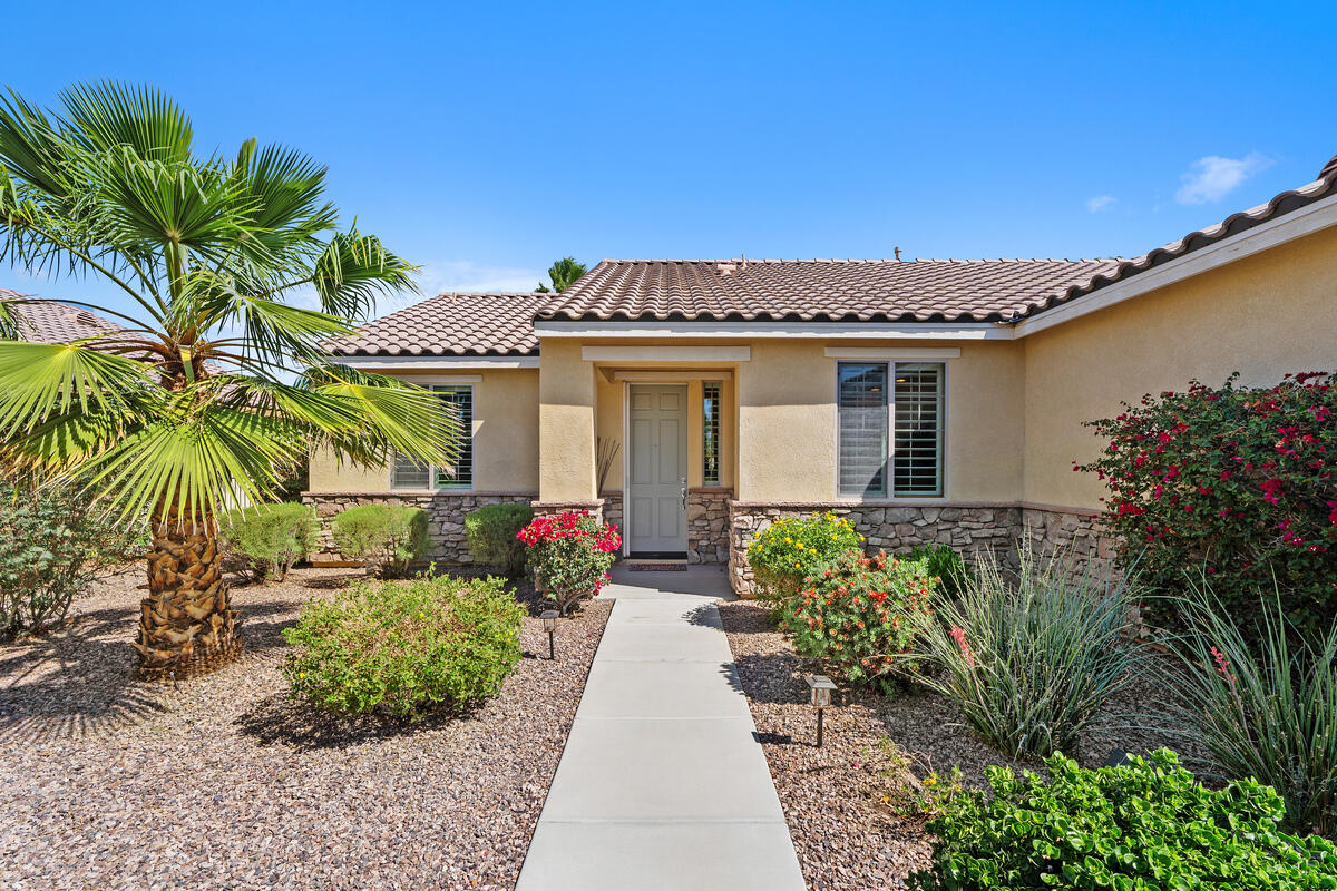 81220 Corte Tolon Indio, CA 92203 - Photo 3 of 42 a front view of a house with garden