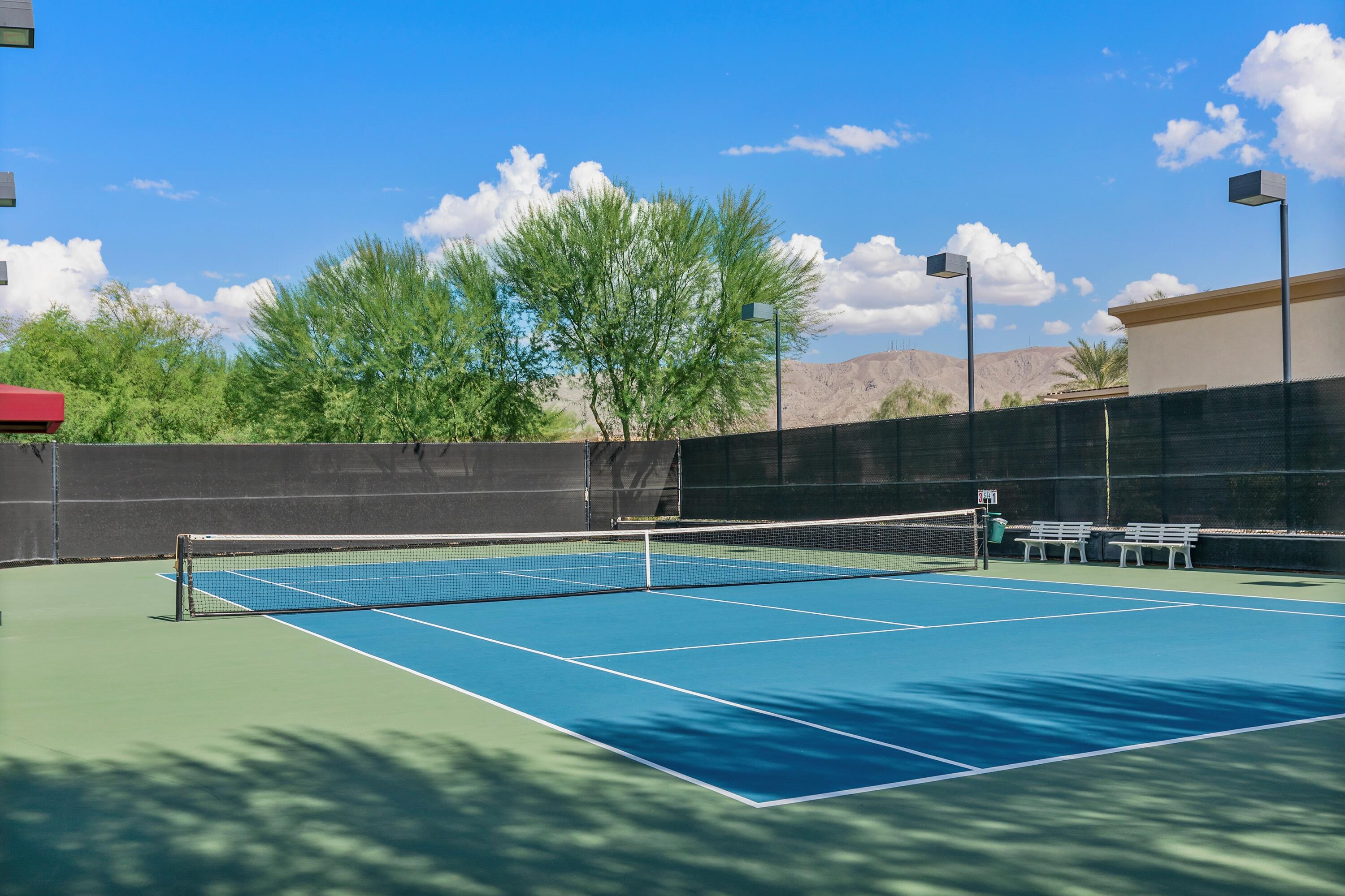 81220 Corte Tolon Indio, CA 92203 - Photo 37 of 42 a view of a tennis court