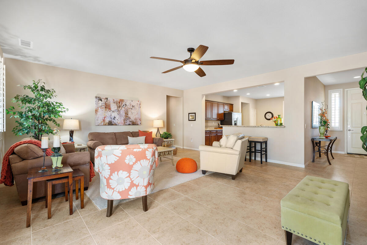 81220 Corte Tolon Indio, CA 92203 - Photo 5 of 42 a living room with furniture a dining table and chairs with a kitchen