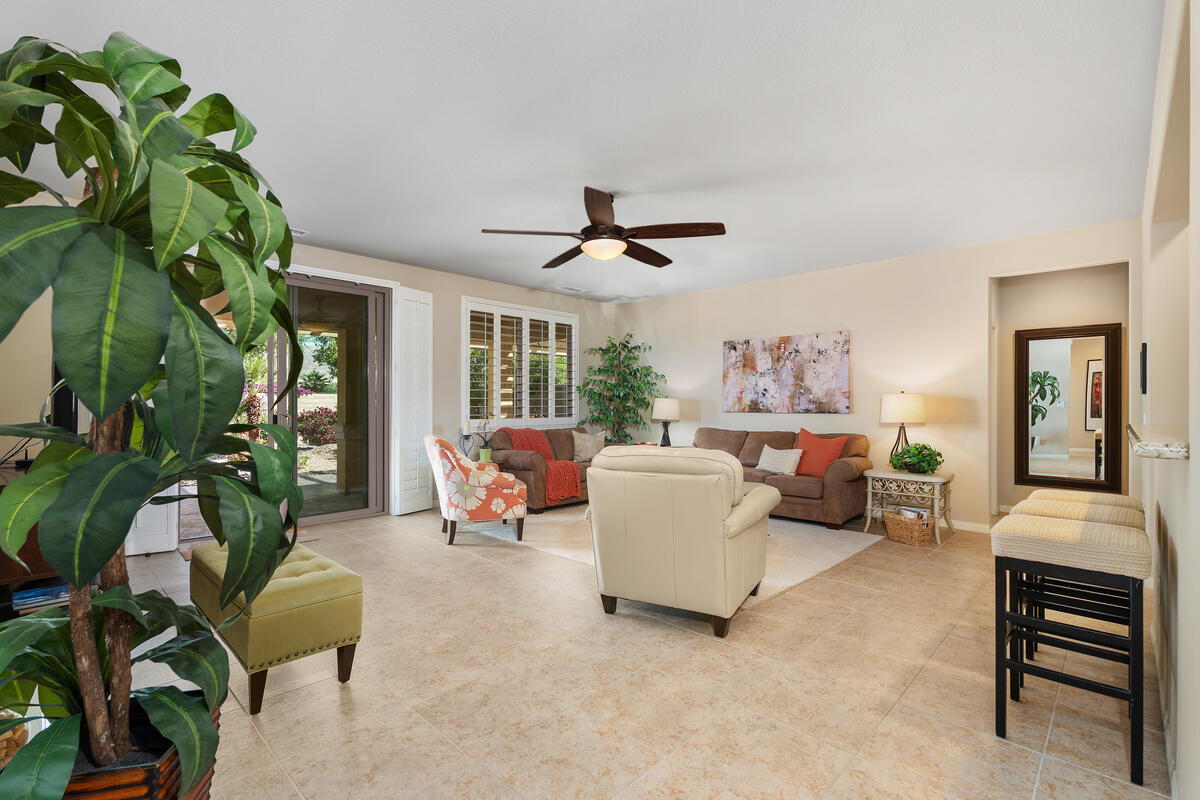 81220 Corte Tolon Indio, CA 92203 - Photo 6 of 42 a living room with furniture plant and a chandelier