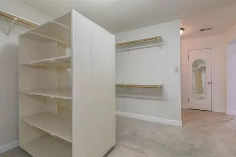 a view of an empty walk in closet